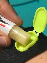 Load image into Gallery viewer, Zebug Wearable Lip Balm Holder with Neoprene strap. Individual Zebug available as well.